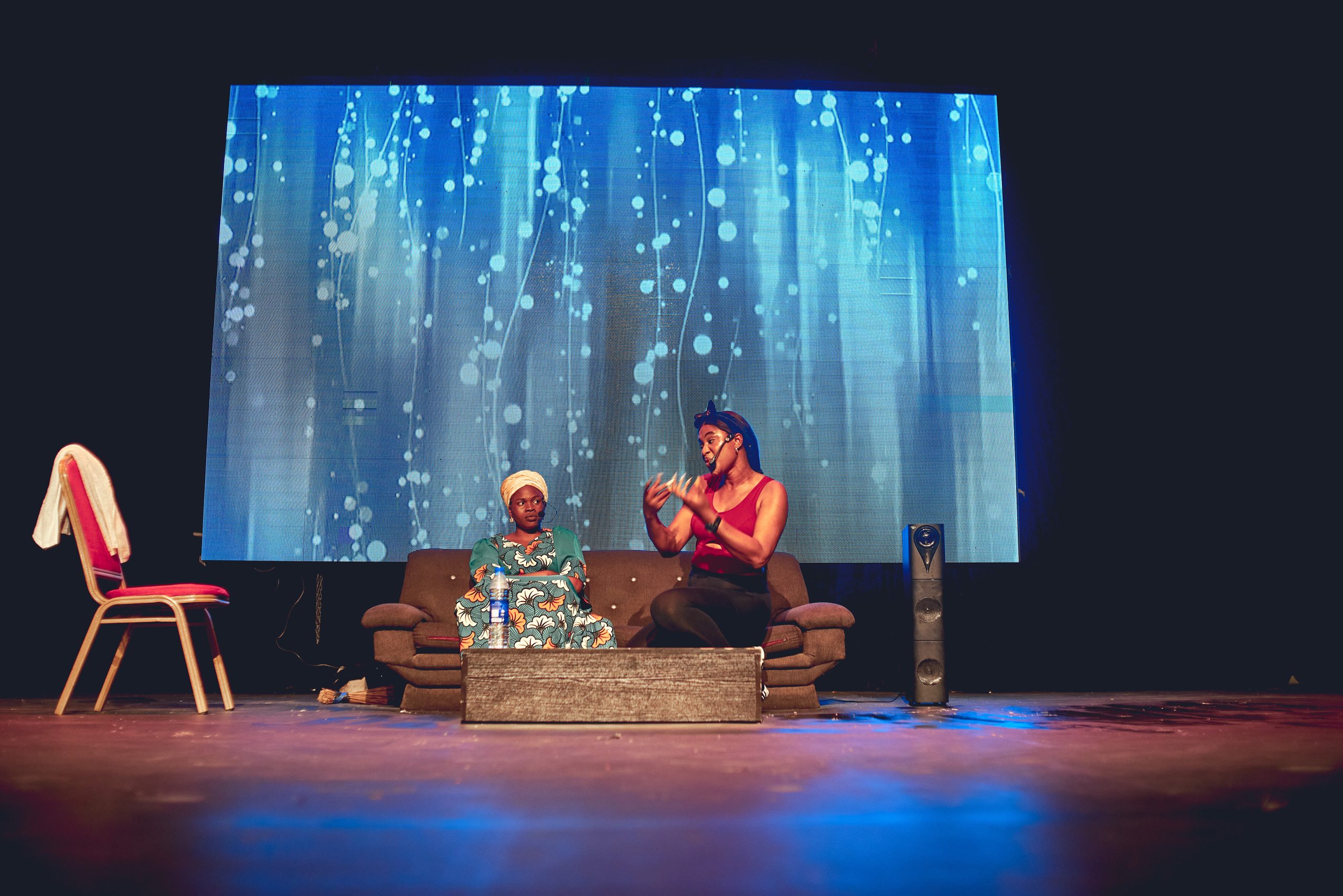 Actors in a tense family scene in Gbas Gbos at TALP‑X 4.0 performances.